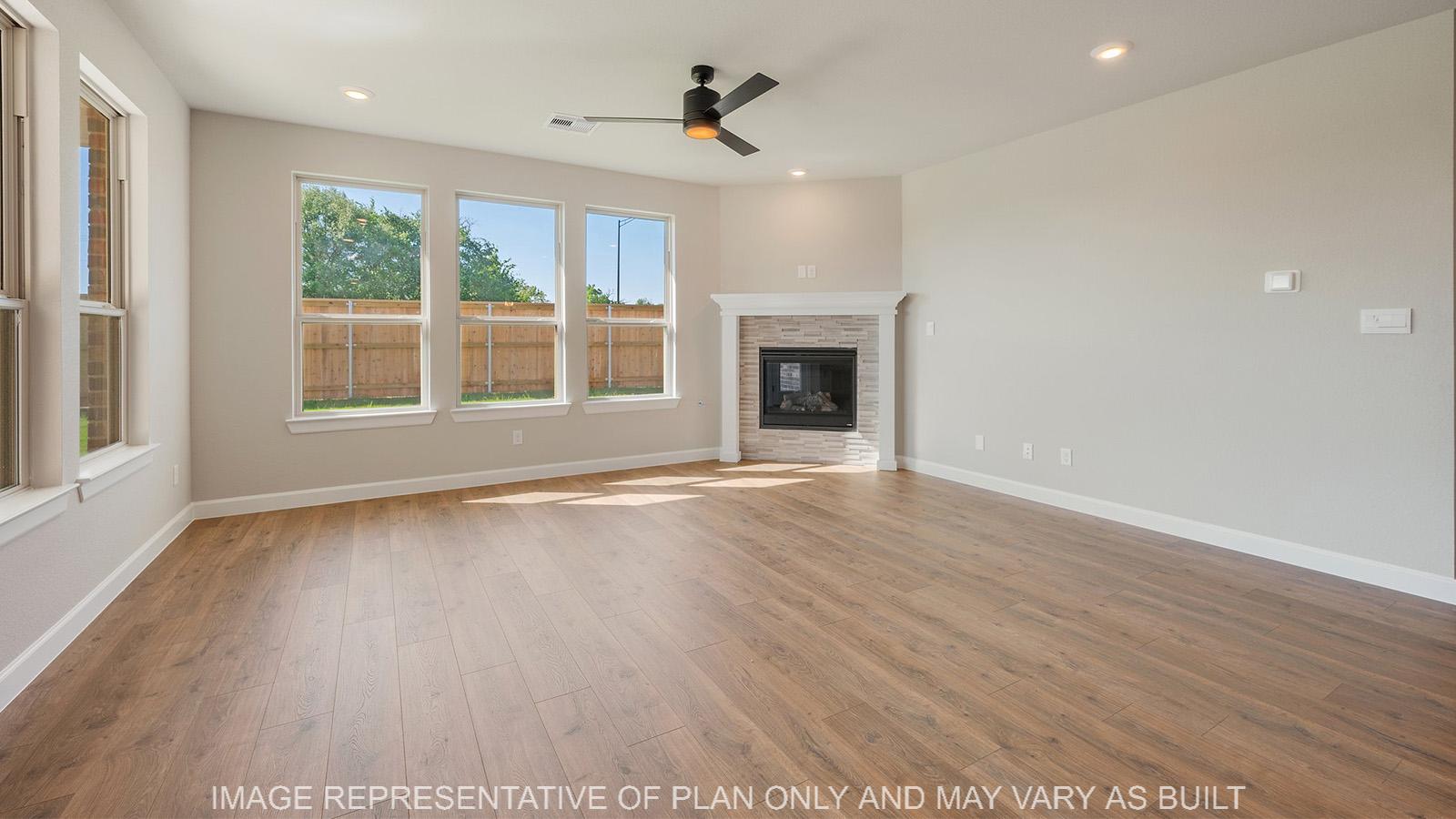 Norwood living room with laminate flooring, corner fireplace, and natural lighting.