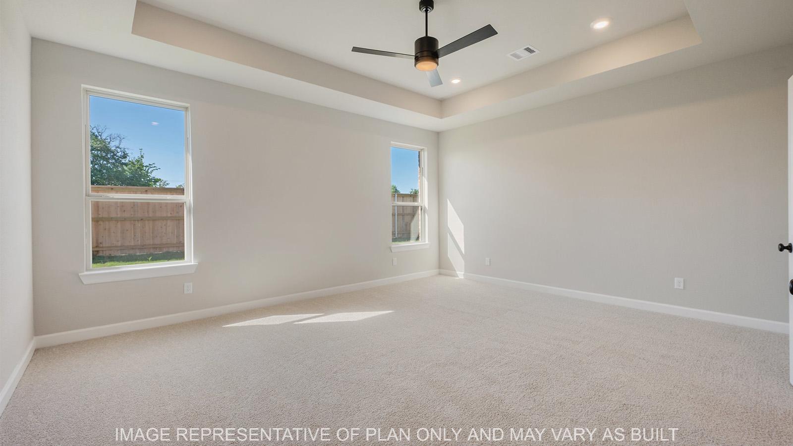 Norwood primary bedroom with carpeted flooring and two windows.
