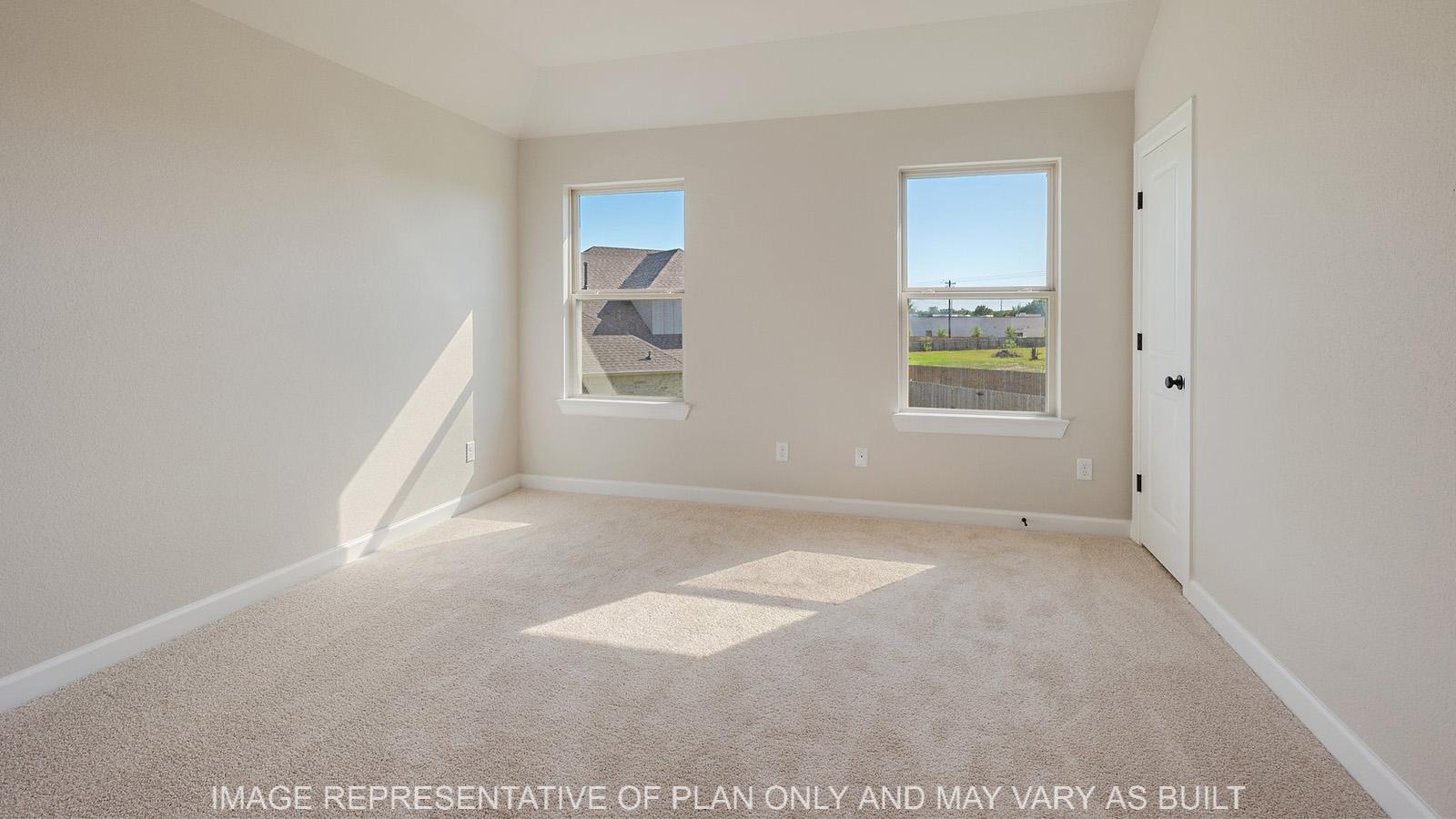 Norwood upstairs study with windows, closet, and carpeted flooring.
