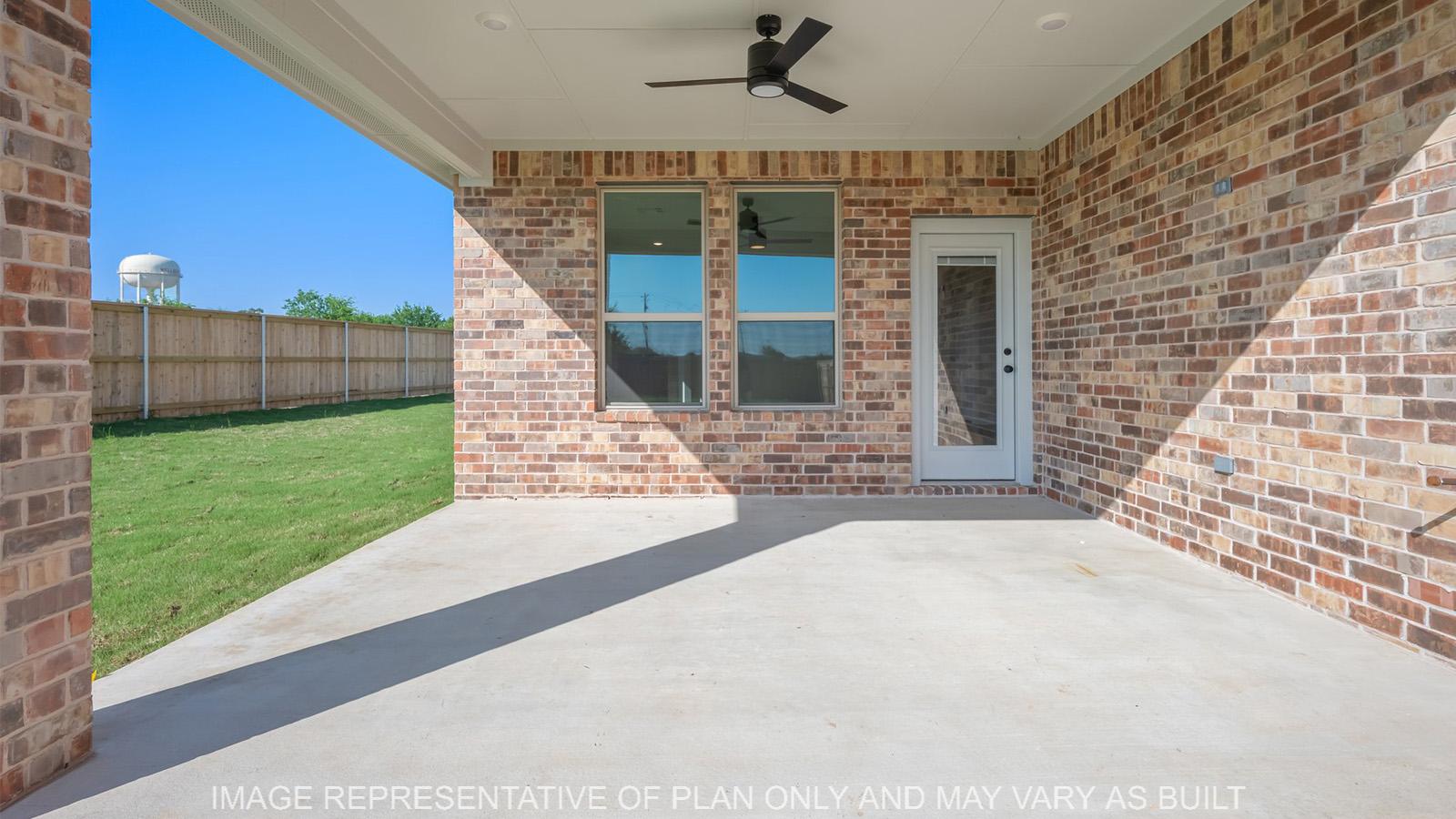 Norwood covered patio with ceiling fan and brick surround.