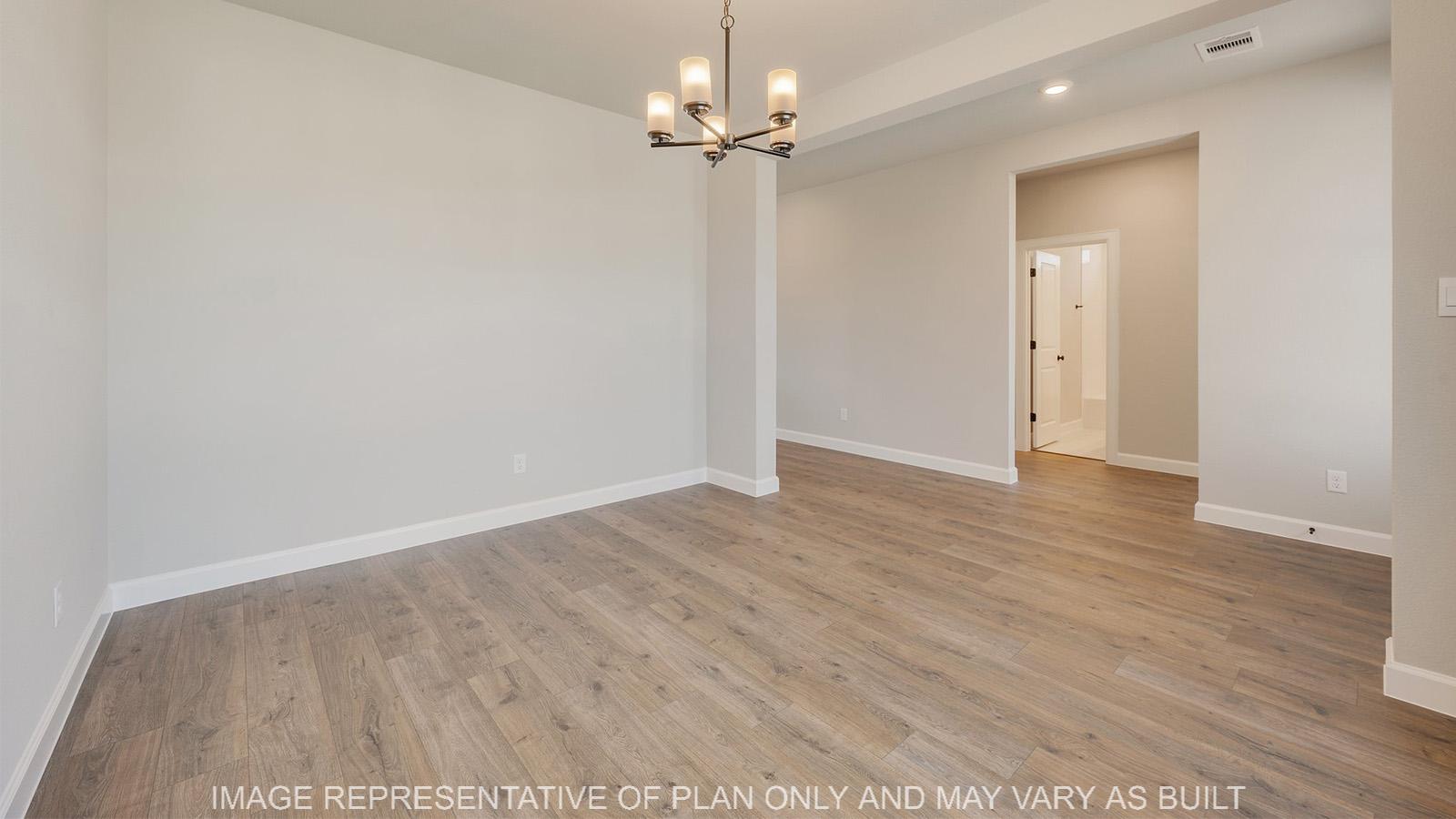 Norwood dining room with laminate flooring and windows.