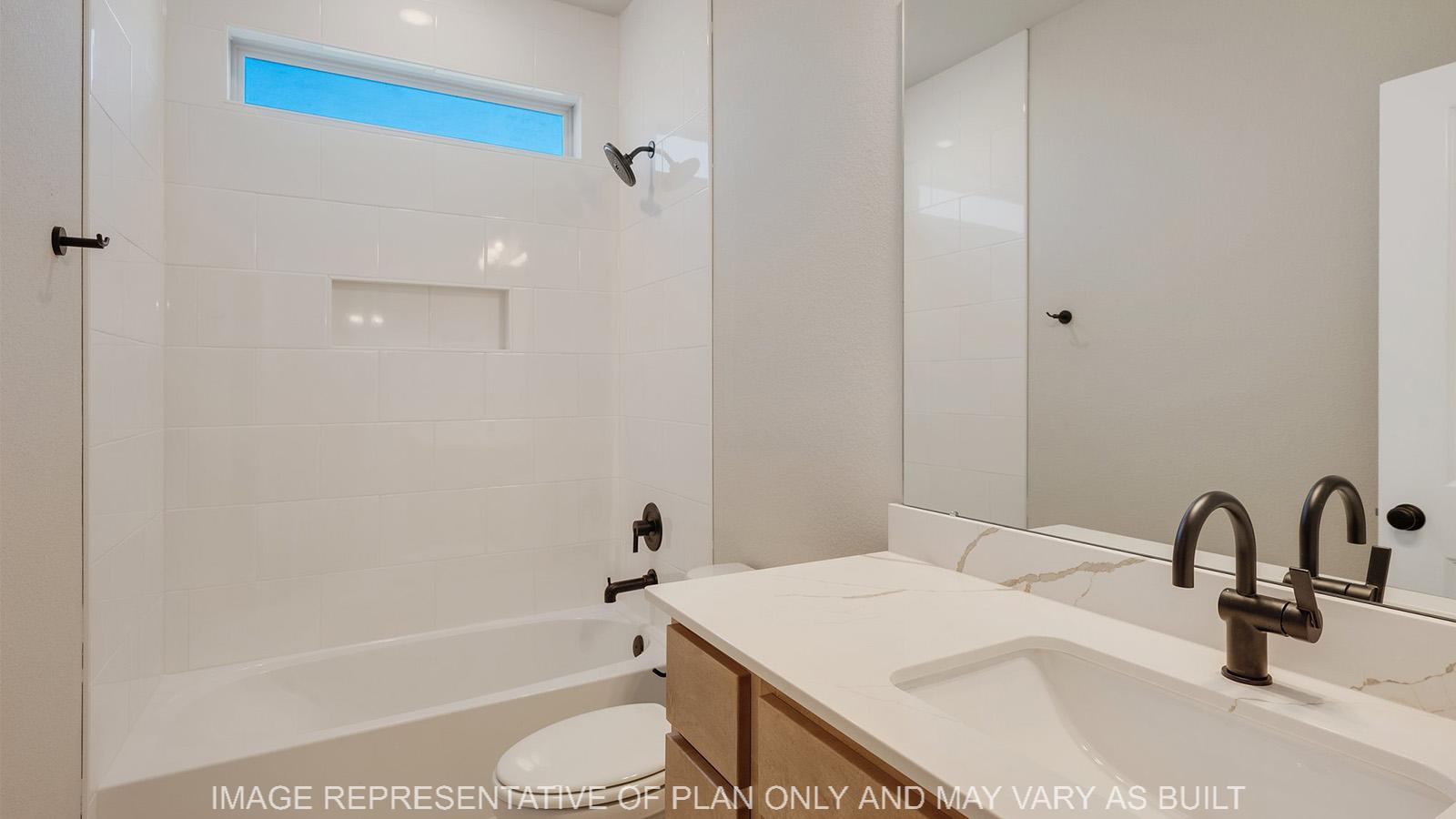 Norwood secondary bathroom with shower/tub combo, maple cabinetry, and quartz vanity.