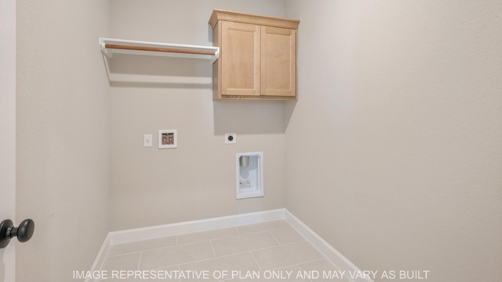 Norwood utility room with head knocker and tile flooring.