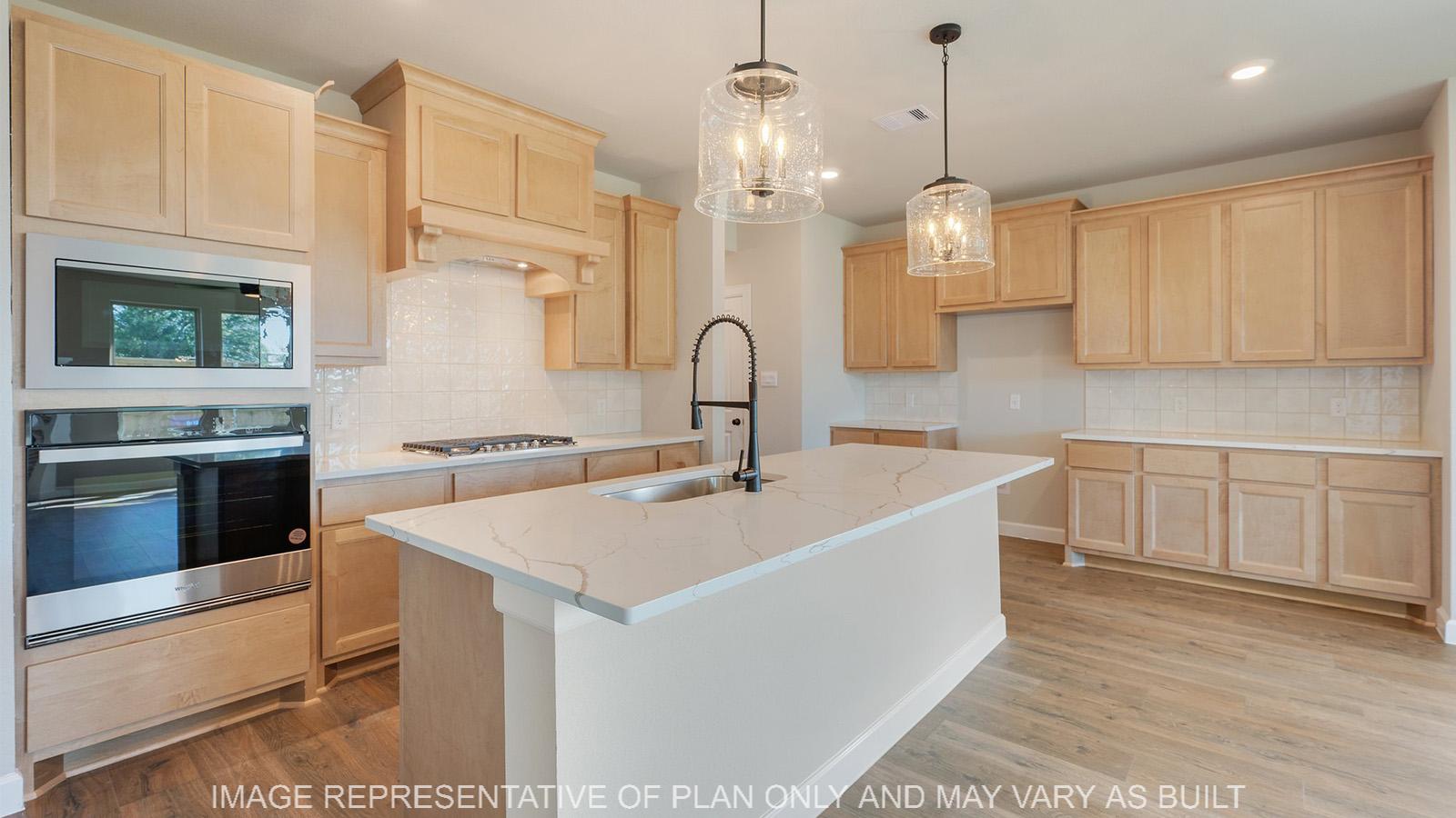 Norwood kitchen with white marble quartz, custom maple cabinetry, and wood laminate flooring.