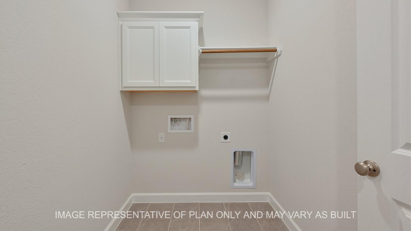 Hampton utility room with tile flooring.