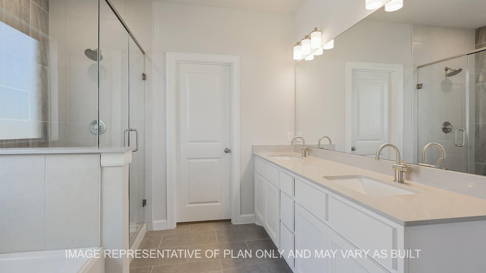 Hampton primary bathroom with quartz countertop dual vanity and tile flooring.