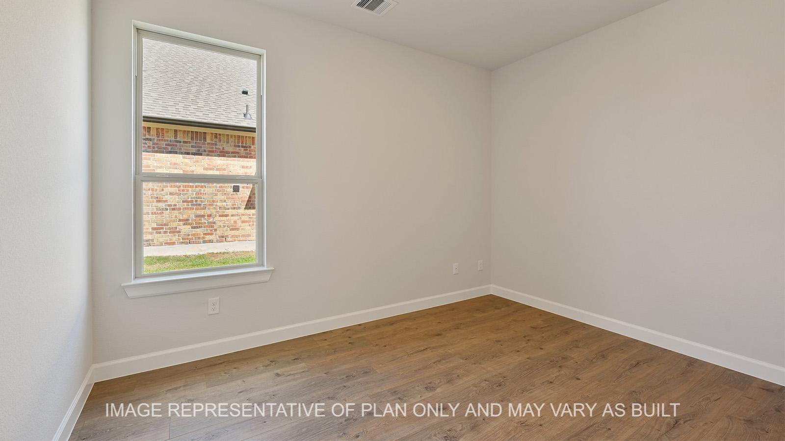 Hampton study with laminate flooring and window.