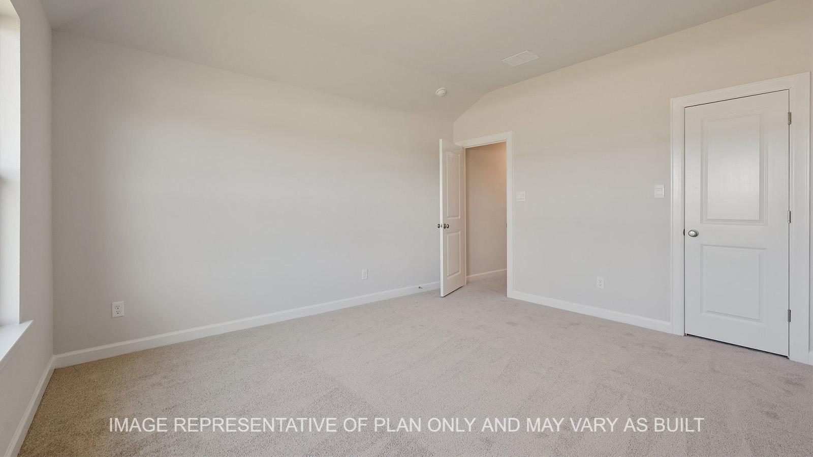 Hampton upstairs secondary bedroom with carpeted flooring and walk-in closet.