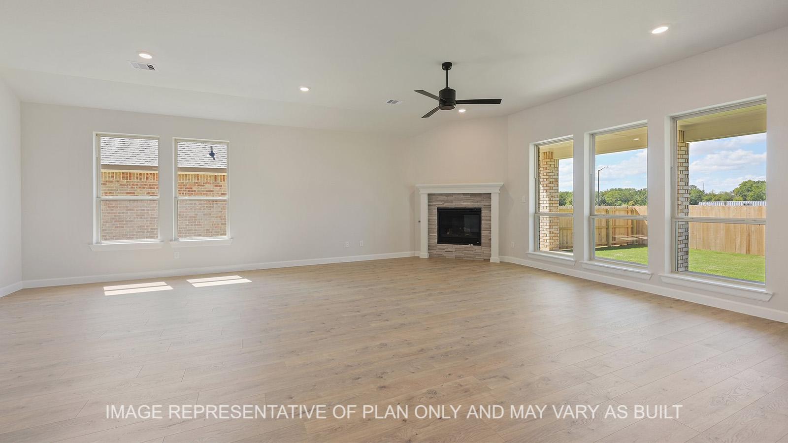 Hampton living room with windows and corner fireplace.