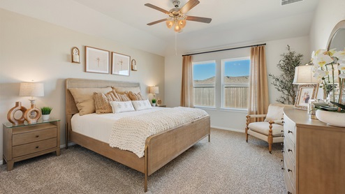Cornerstone Caroline Primary bedroom with neutral farmhouse staging