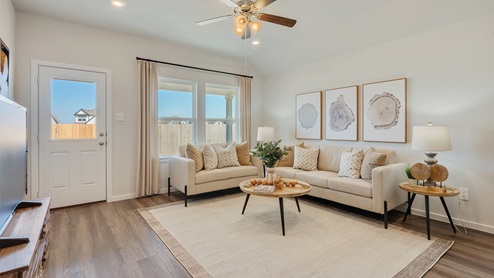Cornerstone Caroline living room with view to back door and cream sofa.