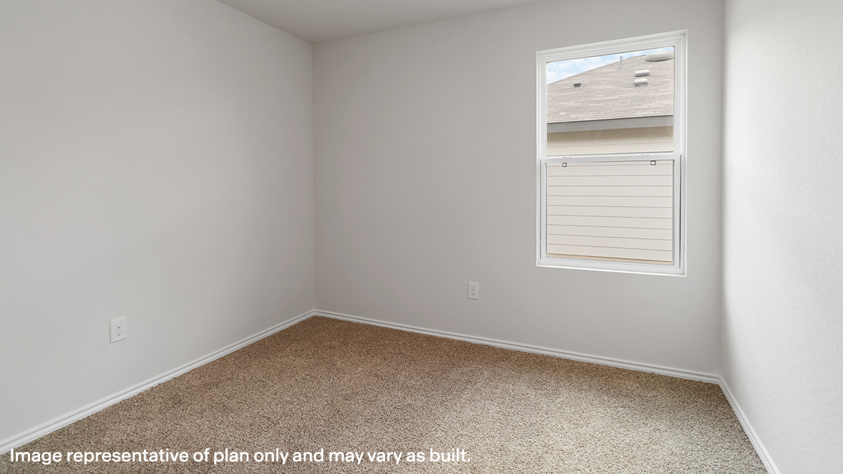 Atlanta secondary bedroom with carpeted flooring and window.