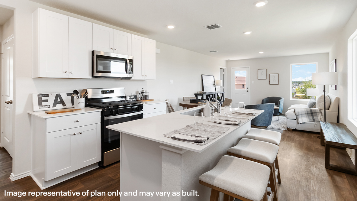Atlanta kitchen with white cabinets and view of dining room and living room.