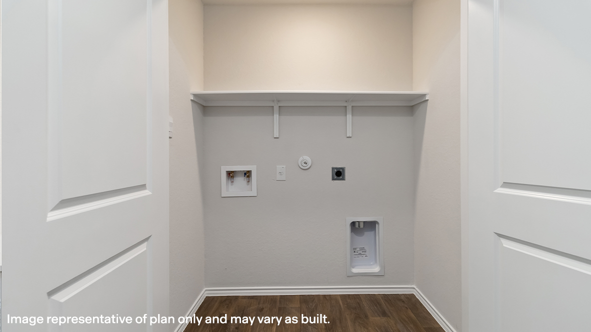 Atlanta utility room with washer and dryer connections and shelving.