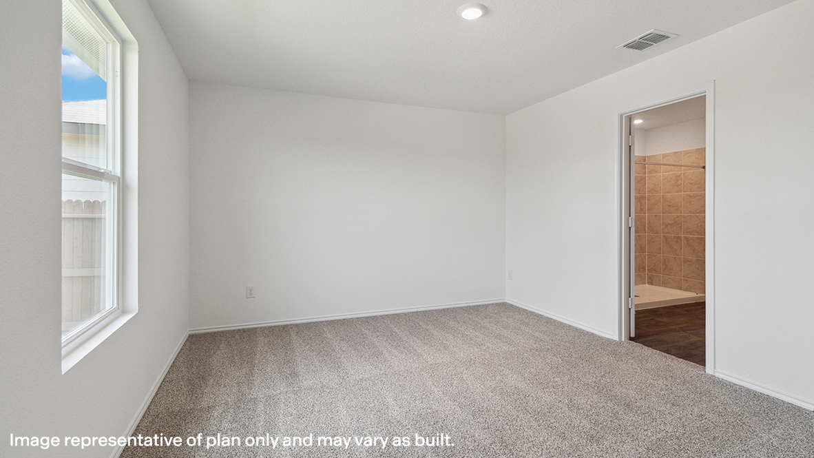 Caprock primary bedroom with carpeted flooring and view of primary bathroom.