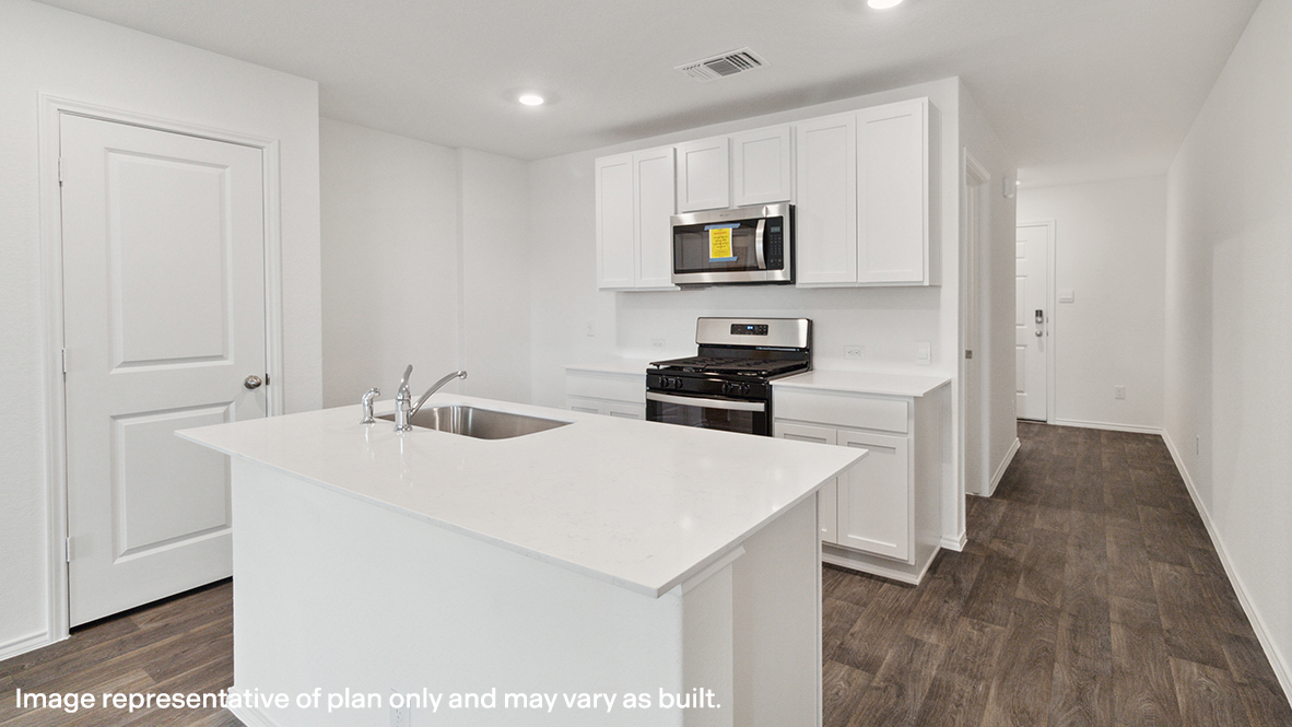 Caprock kitchen center kitchen island with view of entry way.