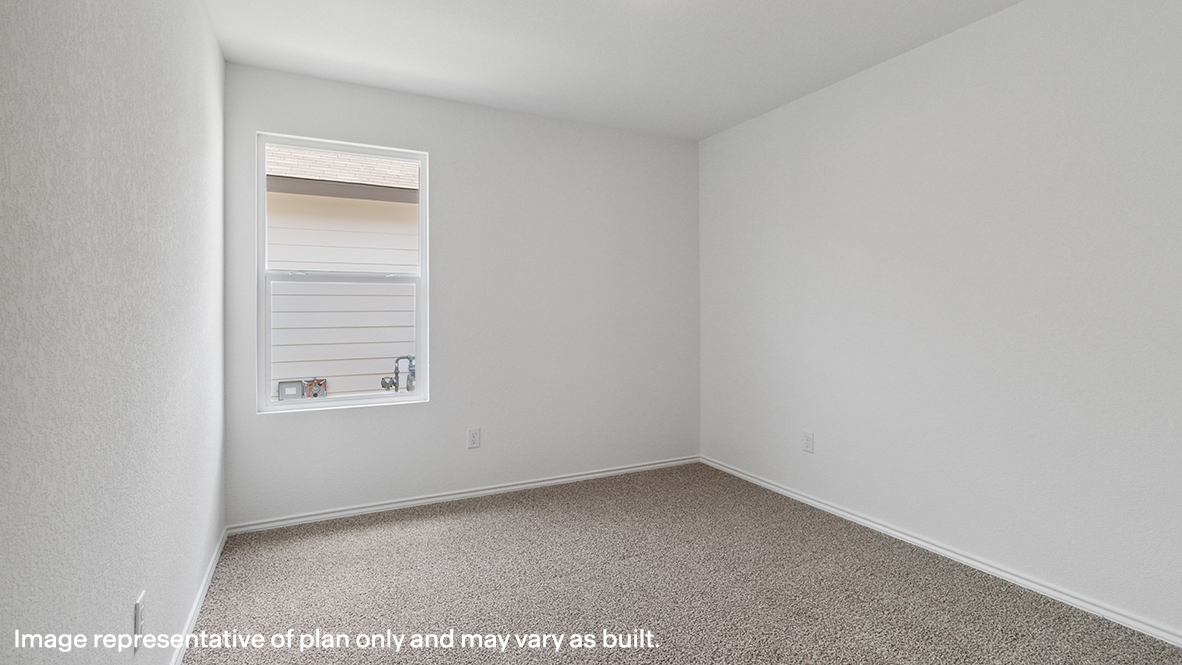 Caprock secondary bedroom with carpeted flooring and window.