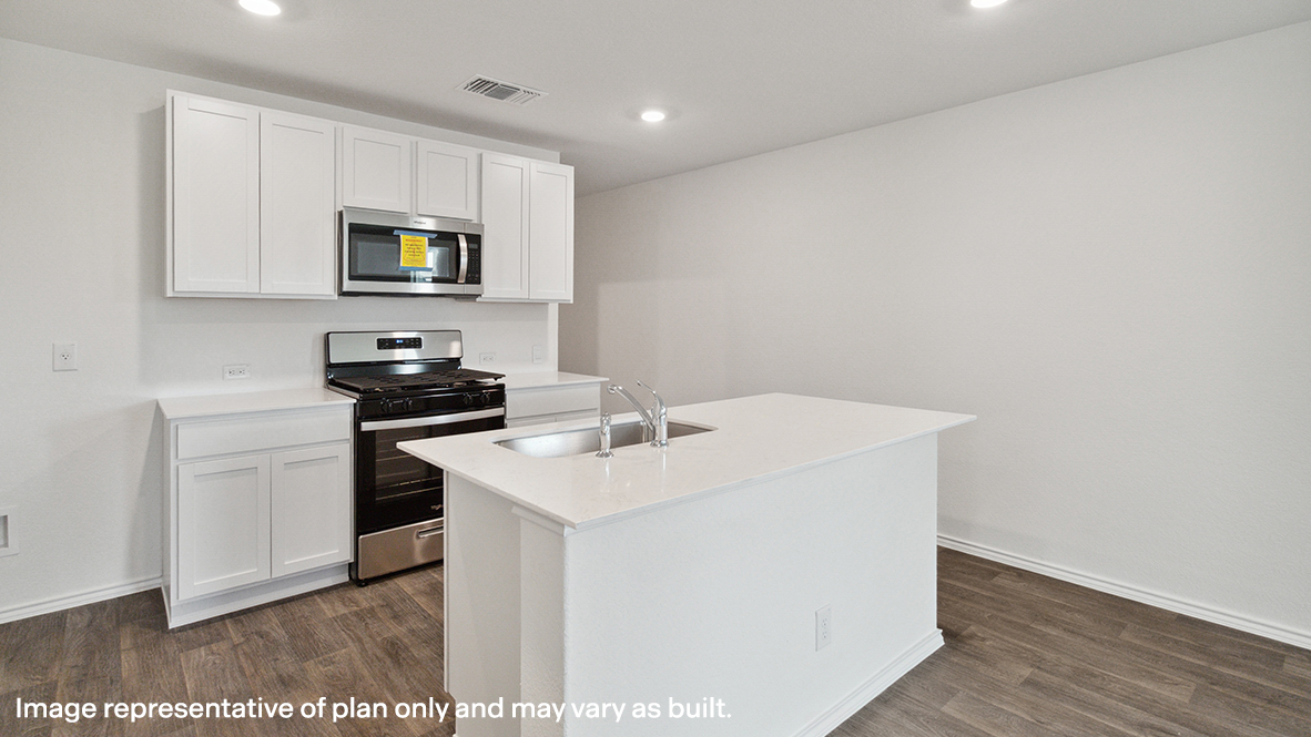 Caprock kitchen with white cabinets and granite countertops.