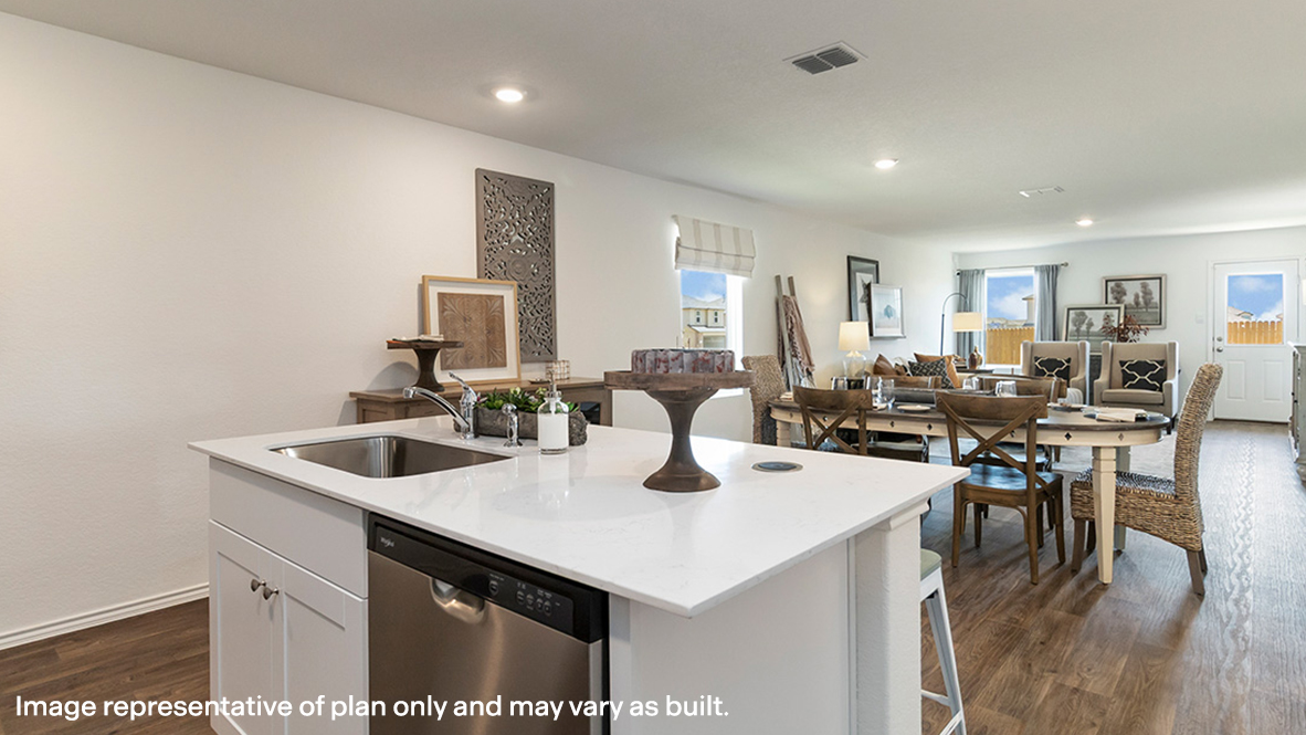 Estero kitchen center kitchen island with view of dining room and living room.