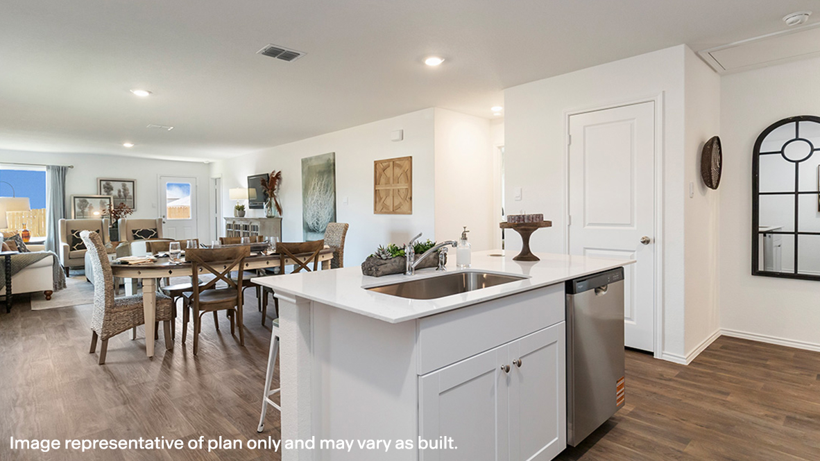 Estero kitchen center kitchen island with view of dining room and living room.