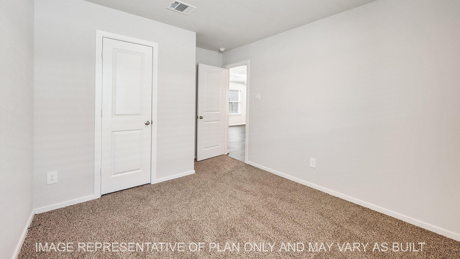 Brooke secondary bedroom with carpeted flooring and closet.
