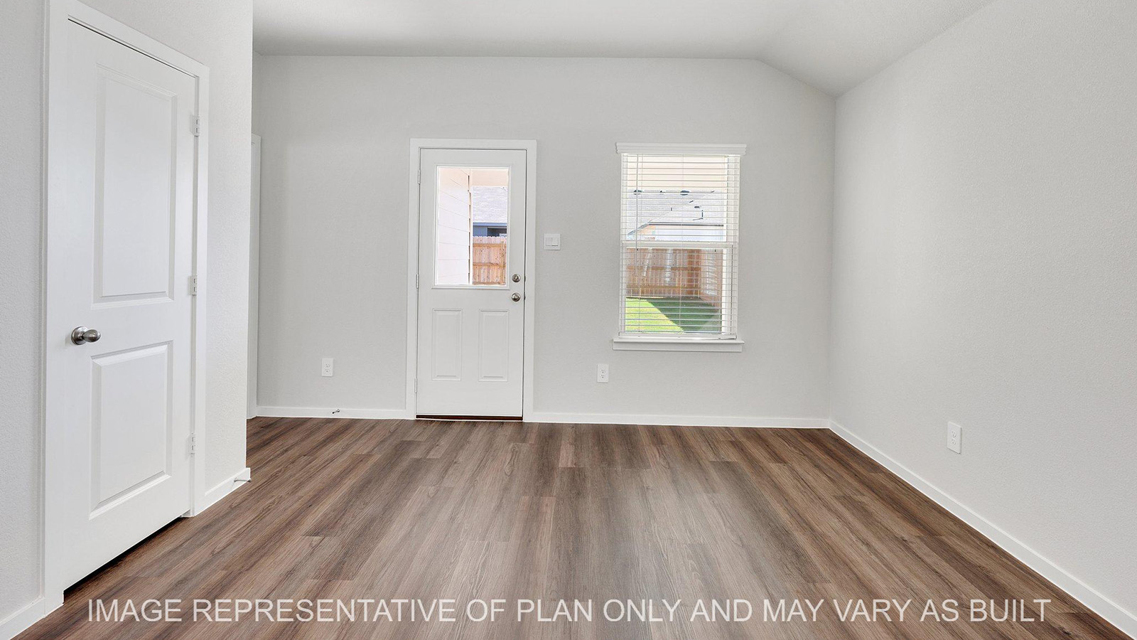 Brooke dining area with window and back door.