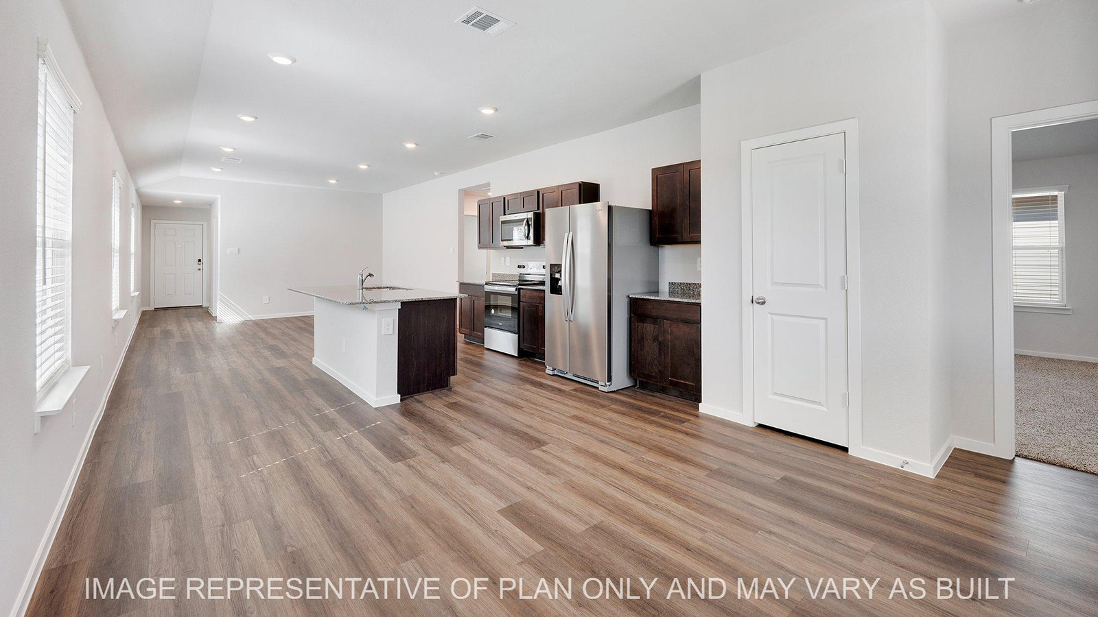 Brooke dining area with view to kitchen and living.