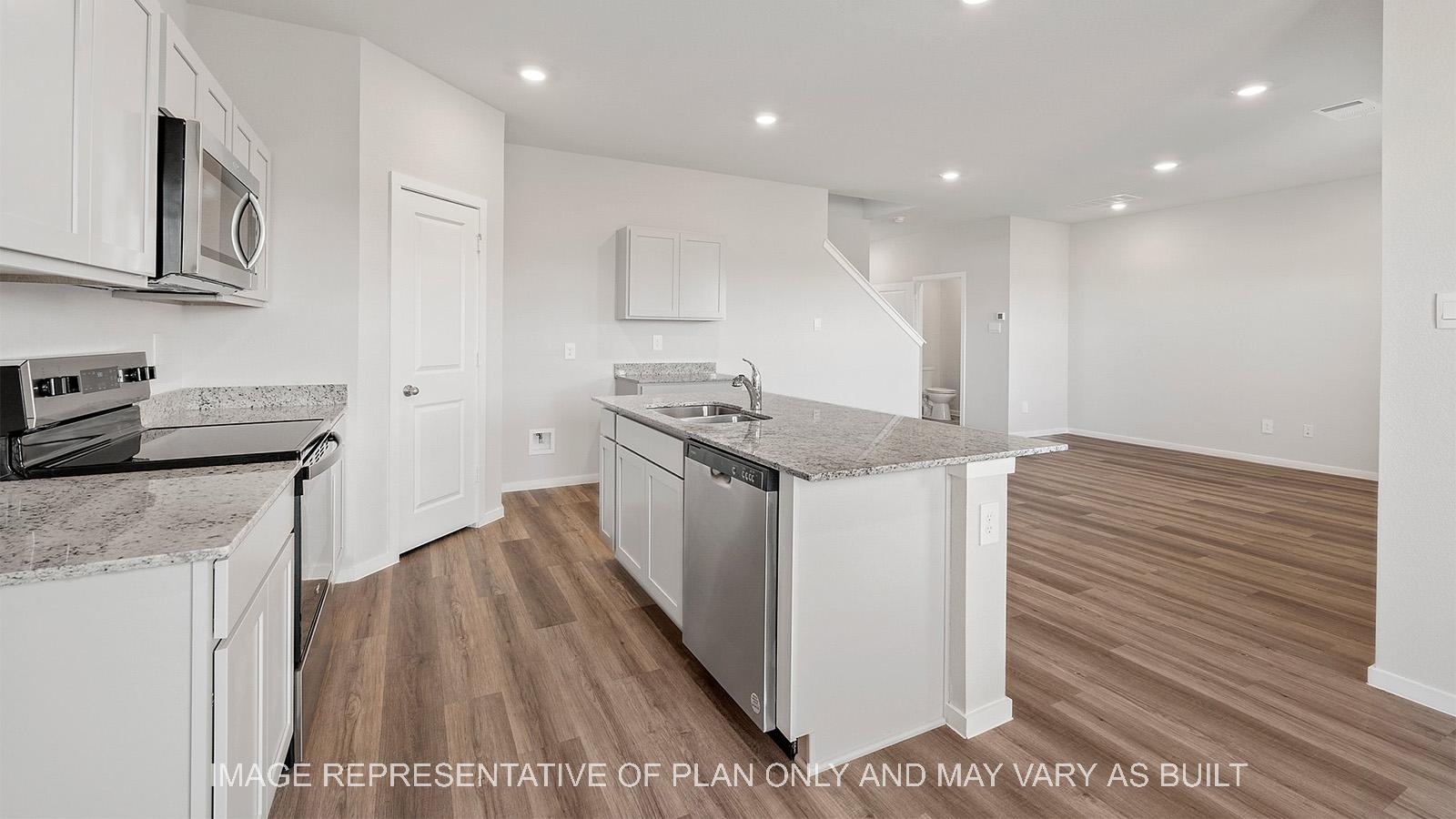 Emma kitchen with stainless steel appliances, corner pantry, and kitchen island.