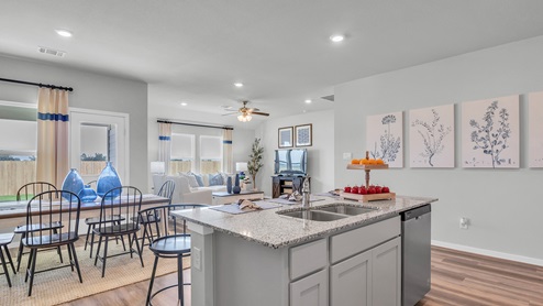 Cornerstone Kitchen with island and view to living room.