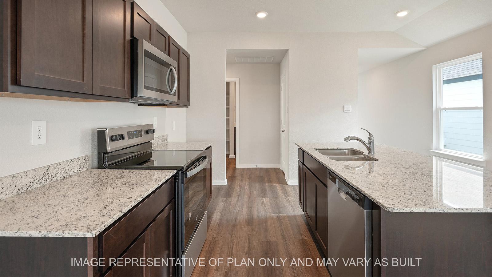 Caroline kitchen with island and stainless steel appliances.