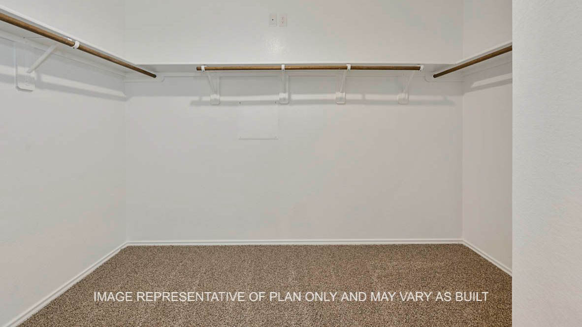 Texas Cali primary bedroom closet with carpet flooring.