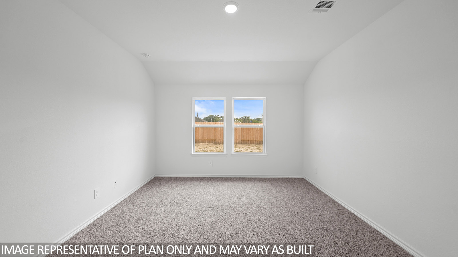 Baxtor primary bedroom with carpet flooring and windows.