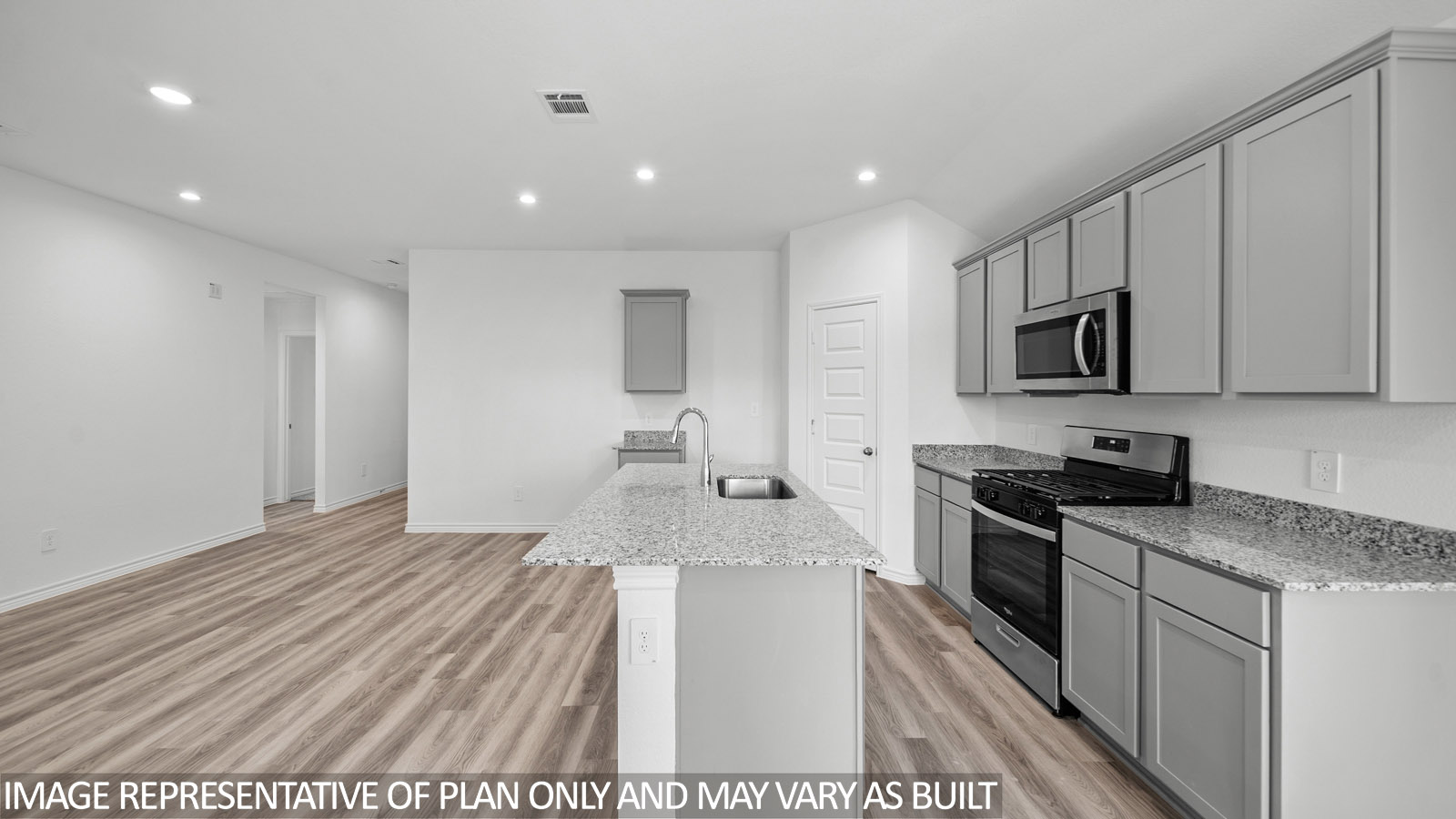 Baxtor large kitchen island with white quartz countertops.