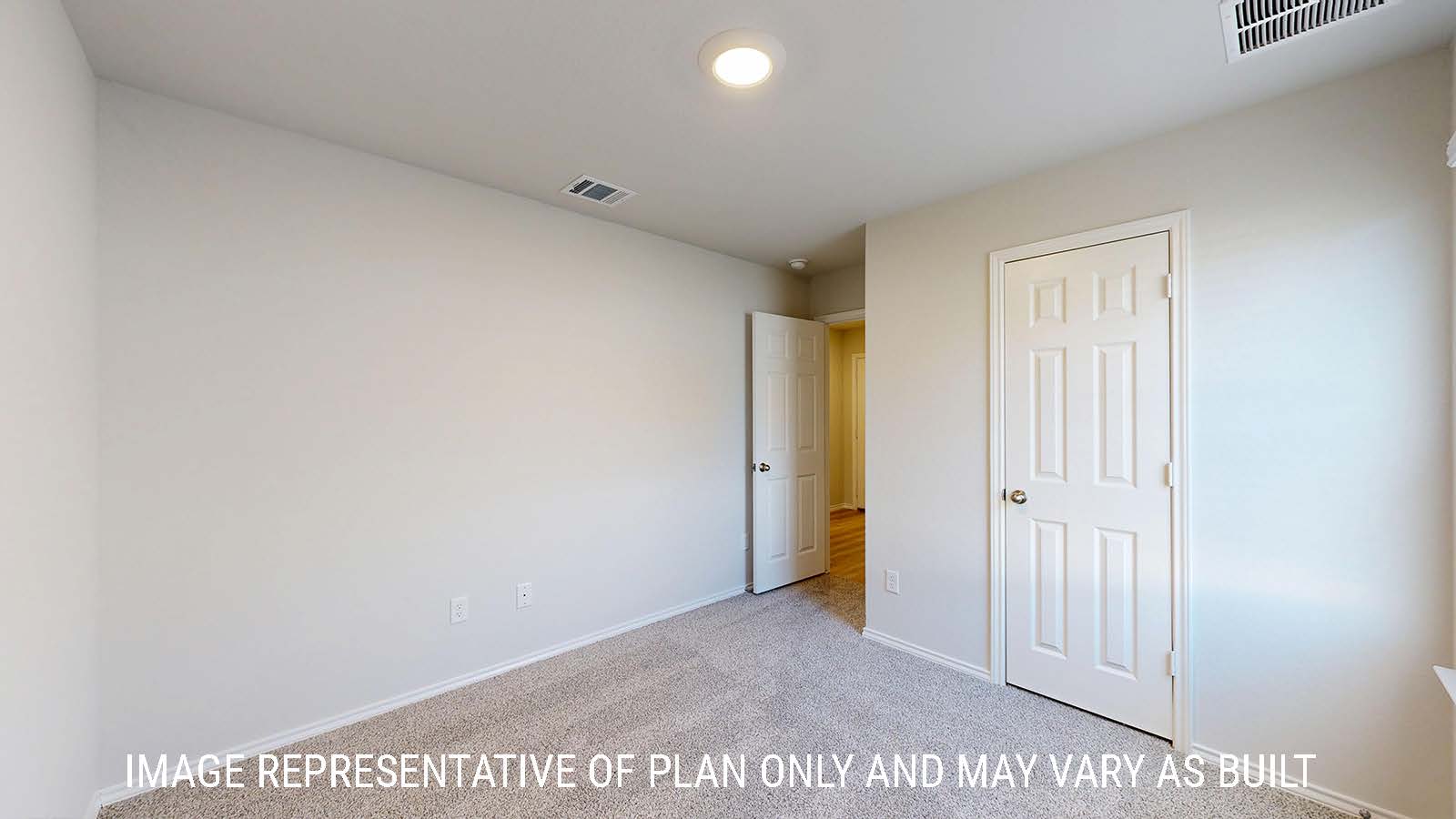 Caden secondary bedroom with carpeted flooring and view of hallway.