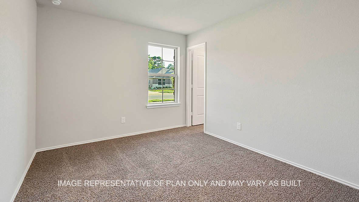 Bellvue secondary bedroom with carpeted flooring, window, and closet.