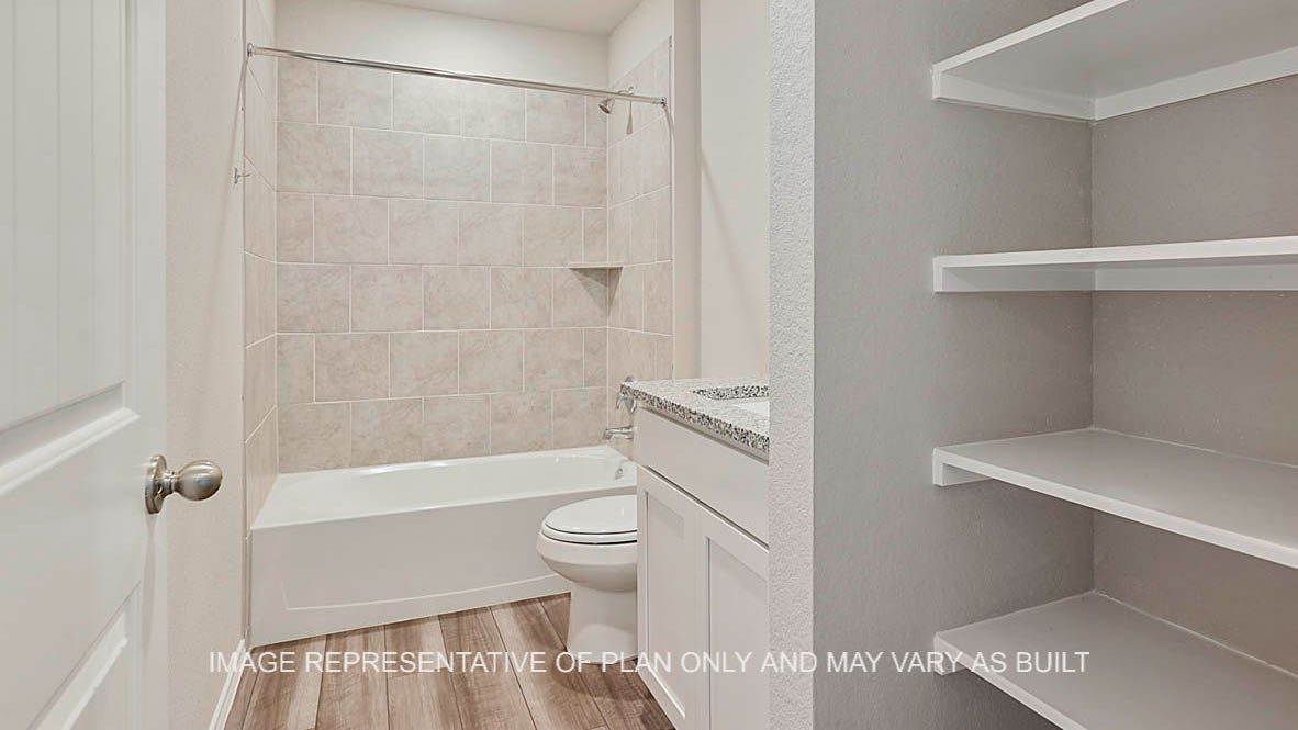Bellvue secondary bathroom with vinyl plank flooring, white cabinets and linen shelving, granite countertops, and ceramic tile shower bath surround.