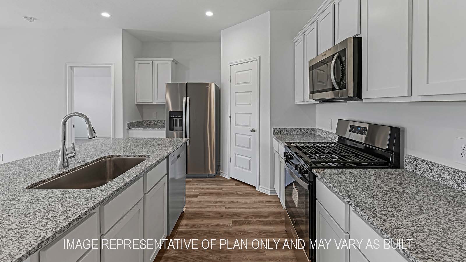 Denton kitchen with stainless steel appliances, island, corner pantry, granite countertops, and white shaker cabinetry.
