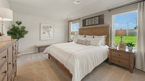 Wilkins Valley primary bedroom with carpeted flooring and windows