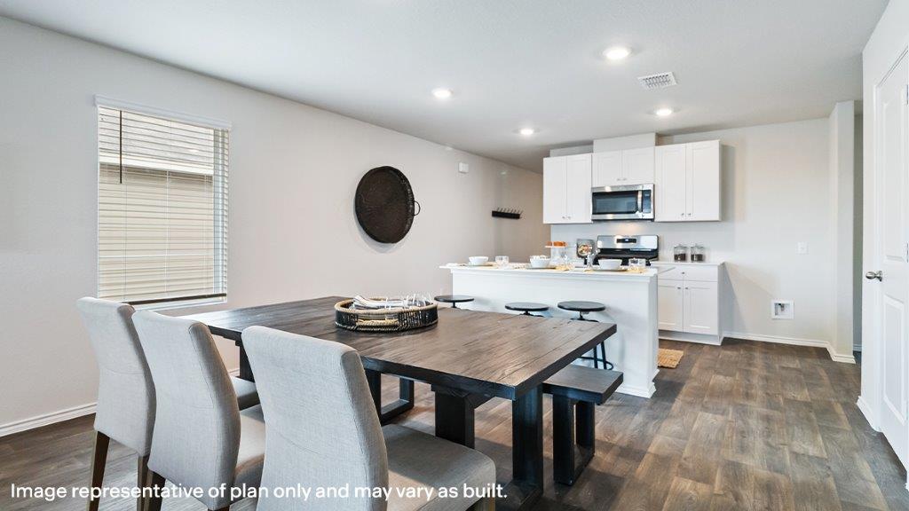 Barton dining room open concept with view of kitchen.