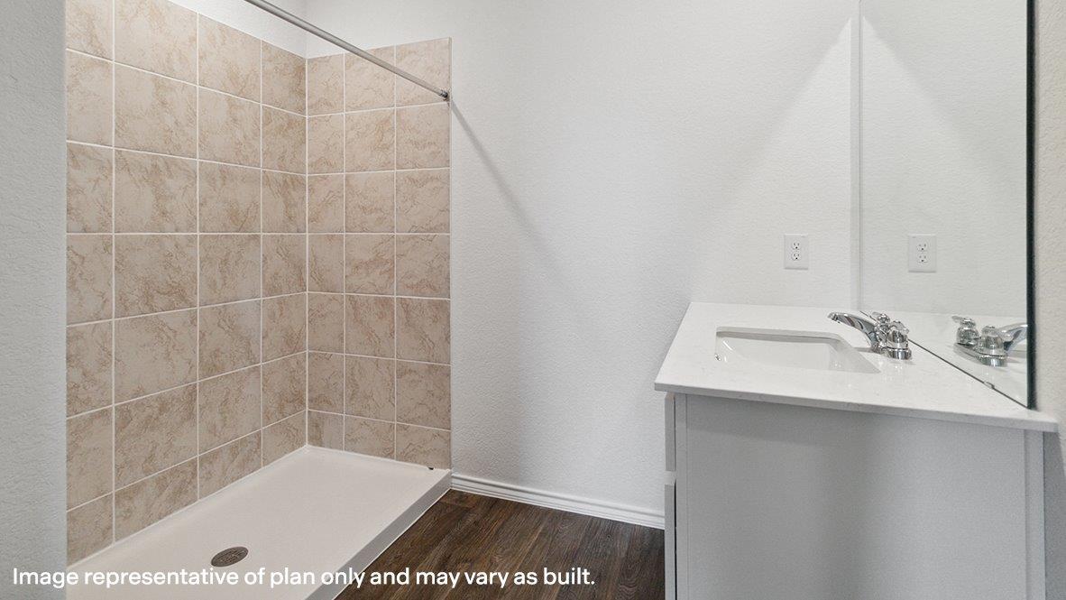 Caprock primary bathroom with single vanity and walk-in shower.