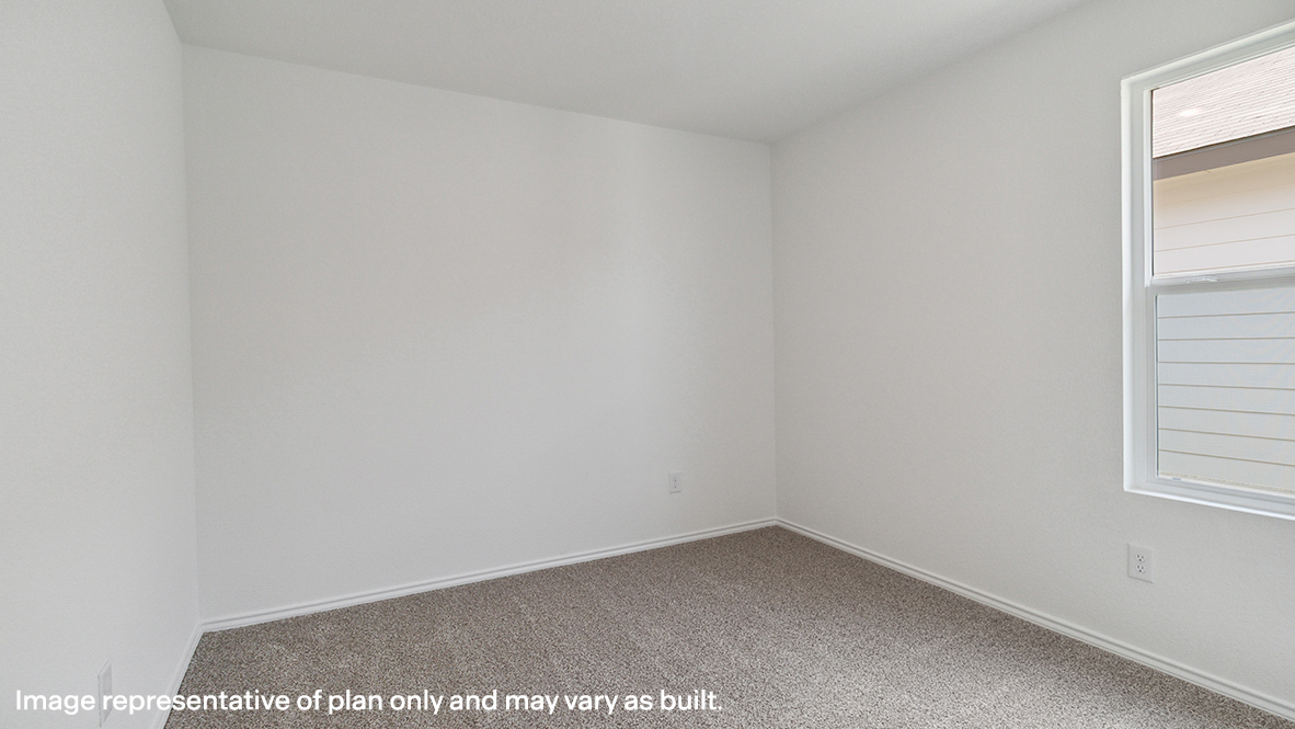 Caprock secondary bedroom with carpeted flooring and window.