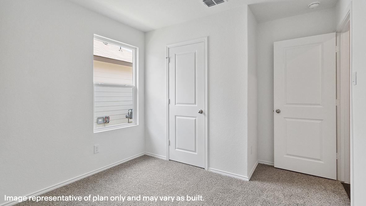 Caprock secondary bedroom with carpeted flooring and window.