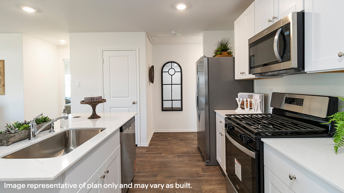 Estero kitchen white cabinets and granite countertops.