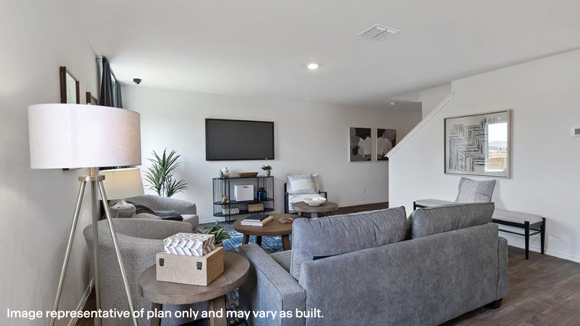 Franklin living room with vinyl plank flooring and view of stairs.