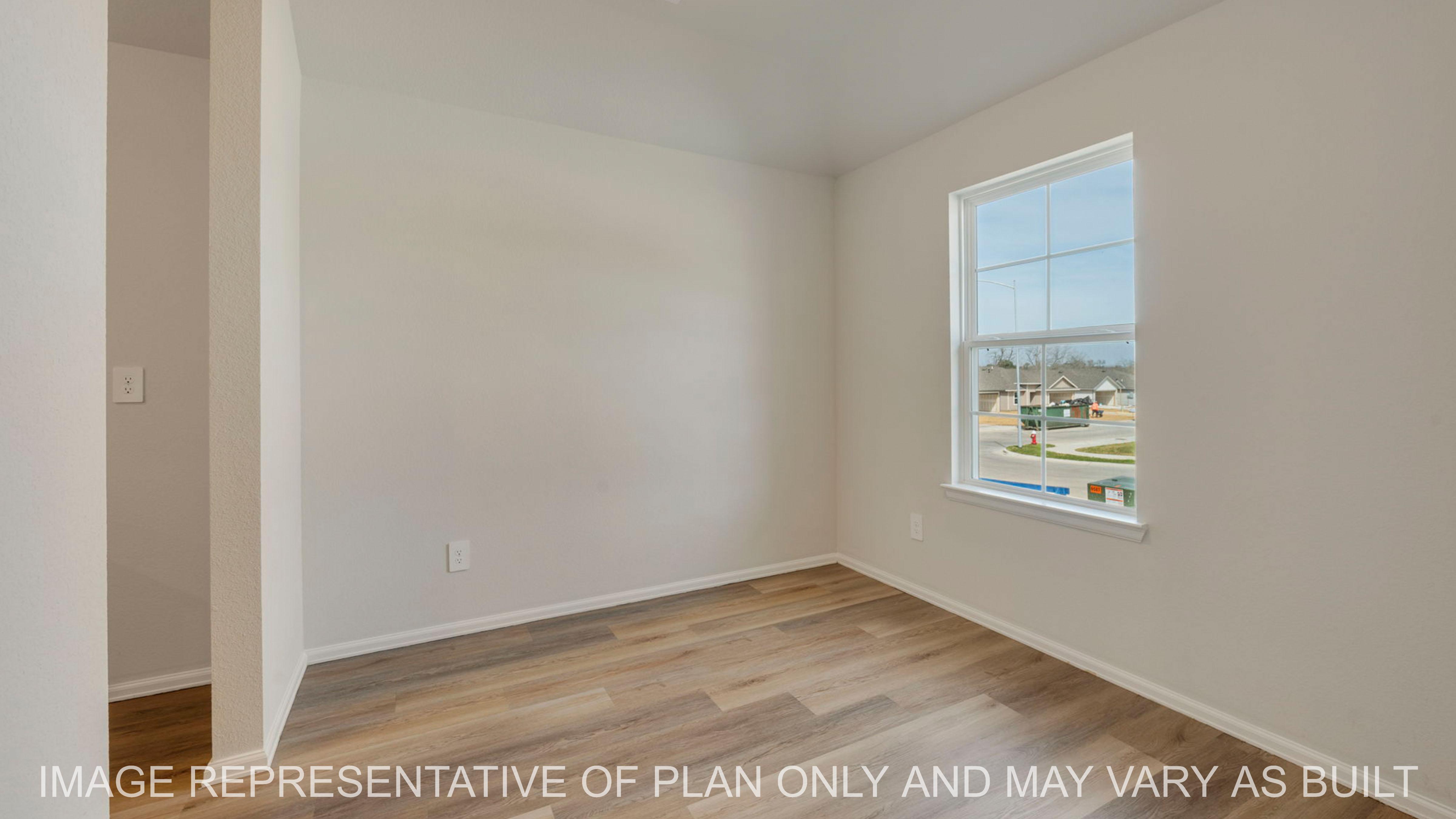 Abbot dining with light wood flooring and window