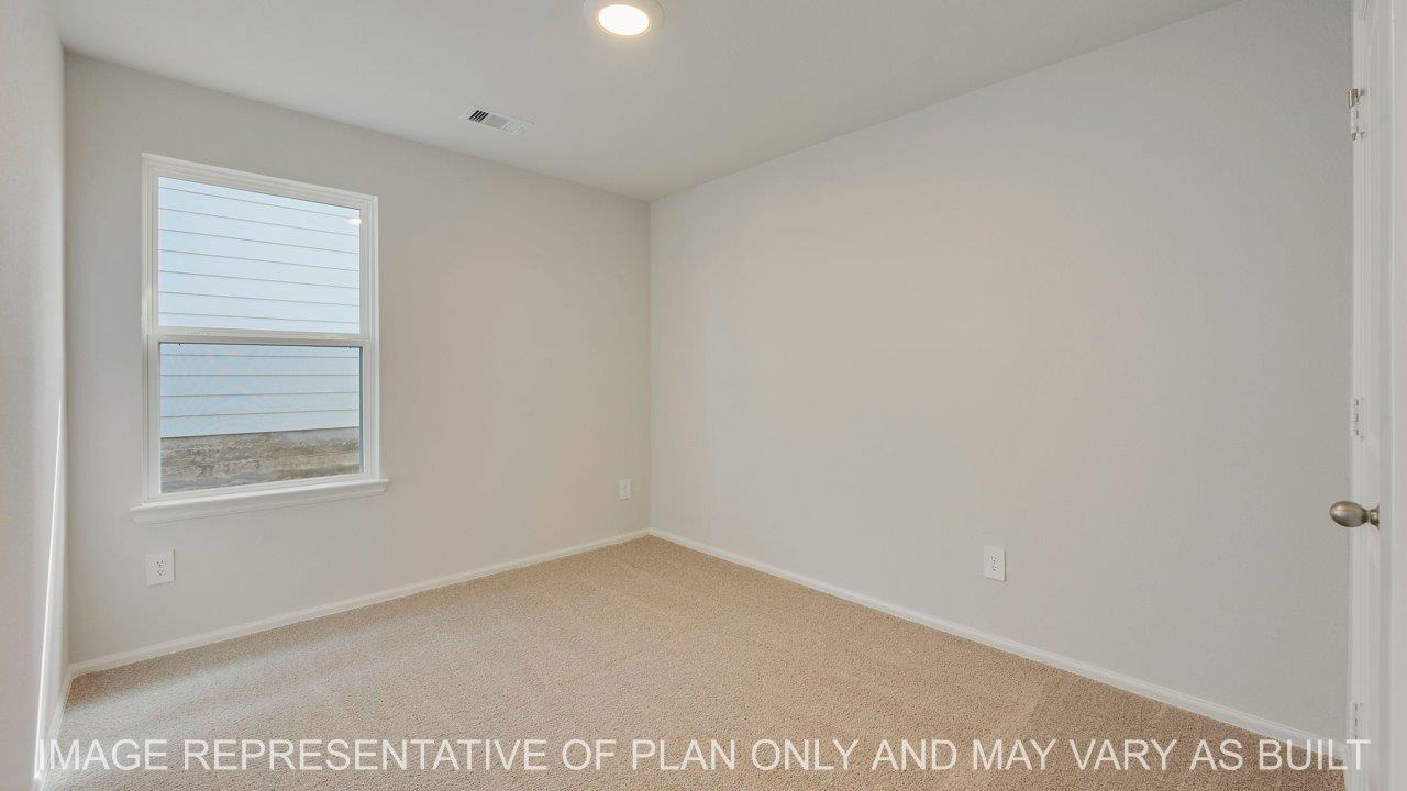 Abbot secondary bedroom with carpet and window