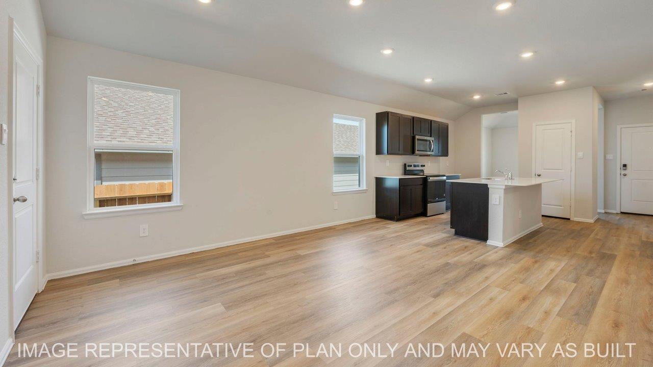 Abbot open concept living with view to kitchen