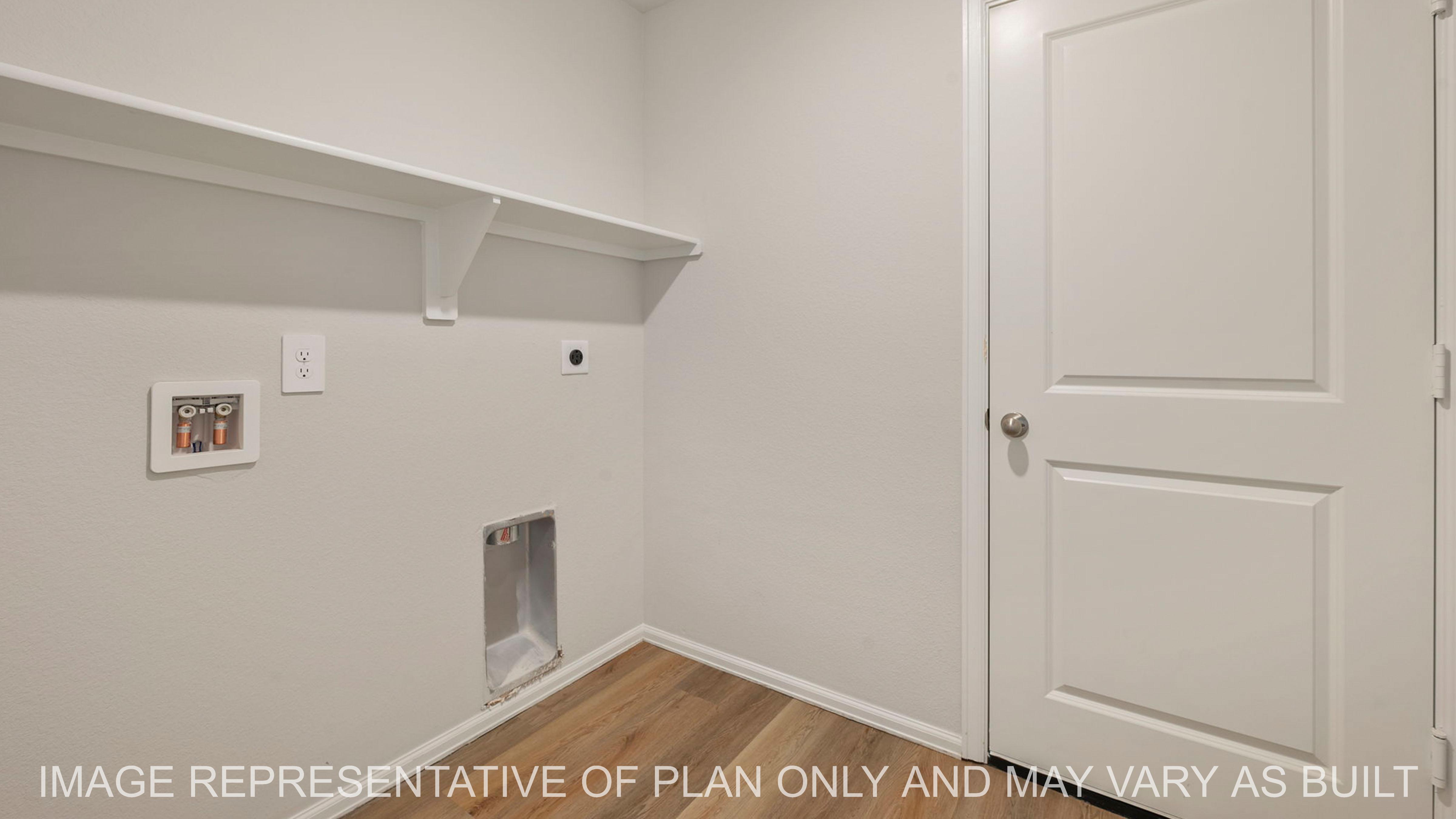 Abbot Utility room with laminate flooring and shelf