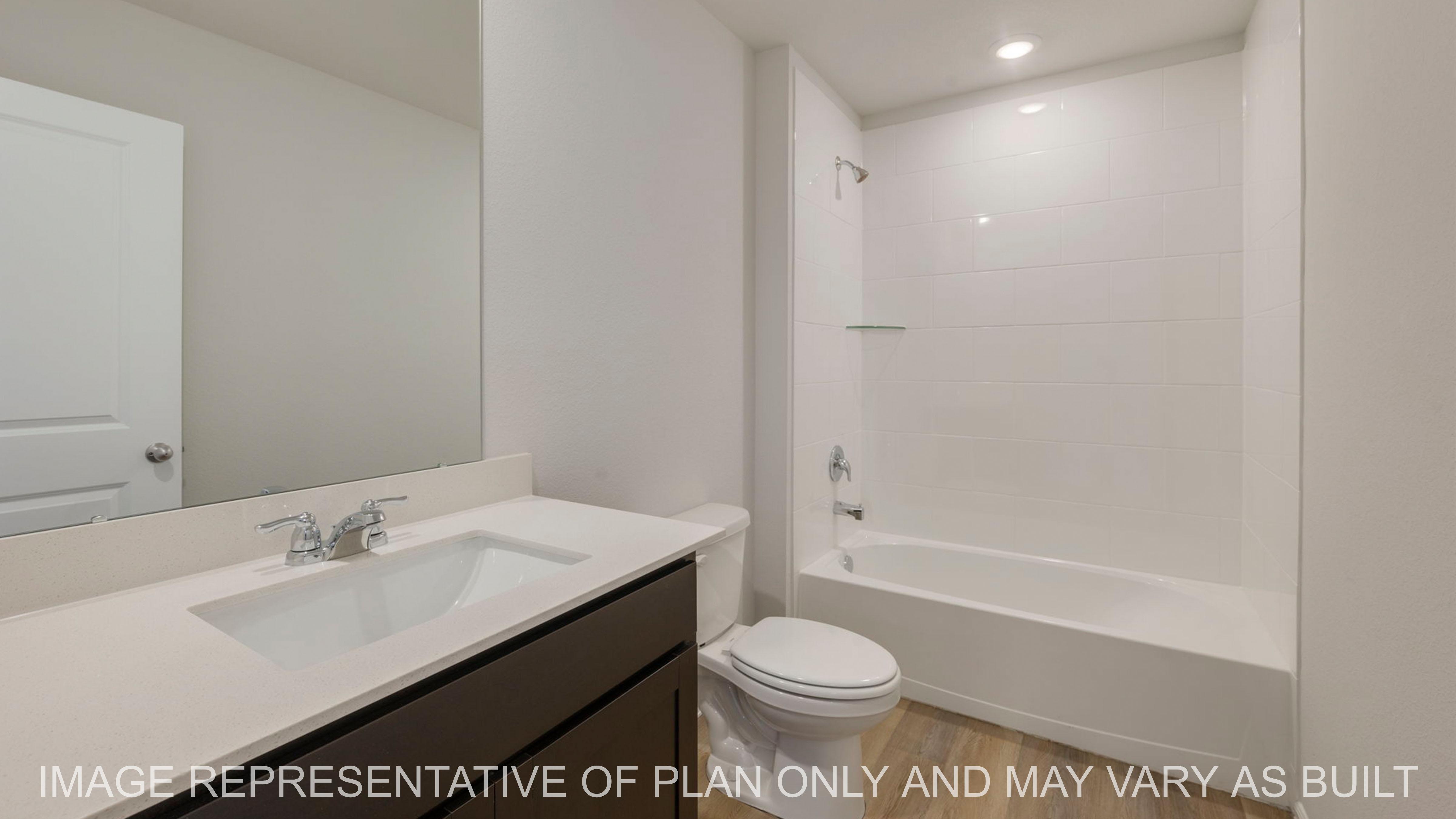 Abbot secondary bathroom with tub shower combo and quartz vanity