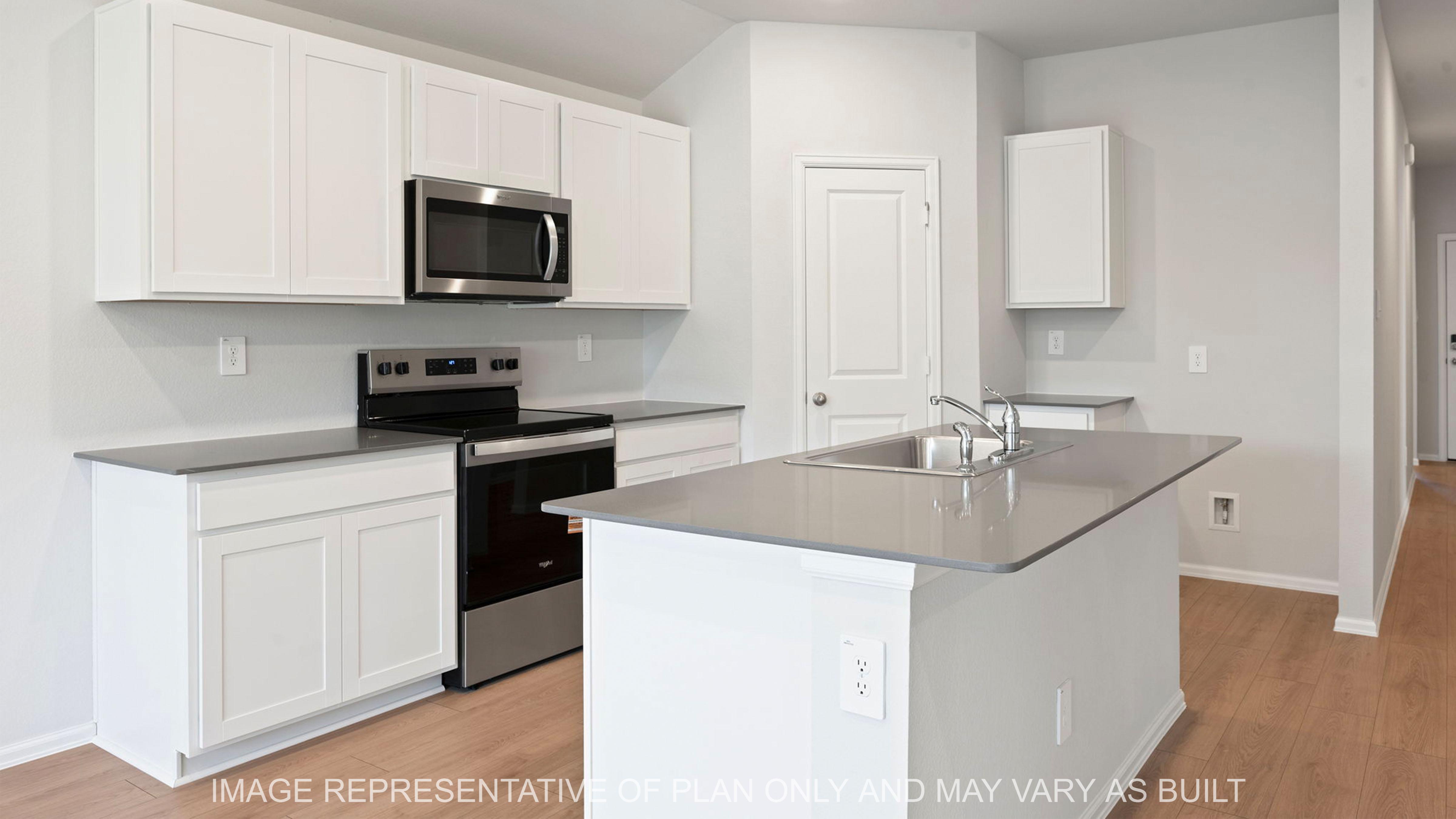 Easton open concept kitchen with gray quartz counter tops and white cabinetry